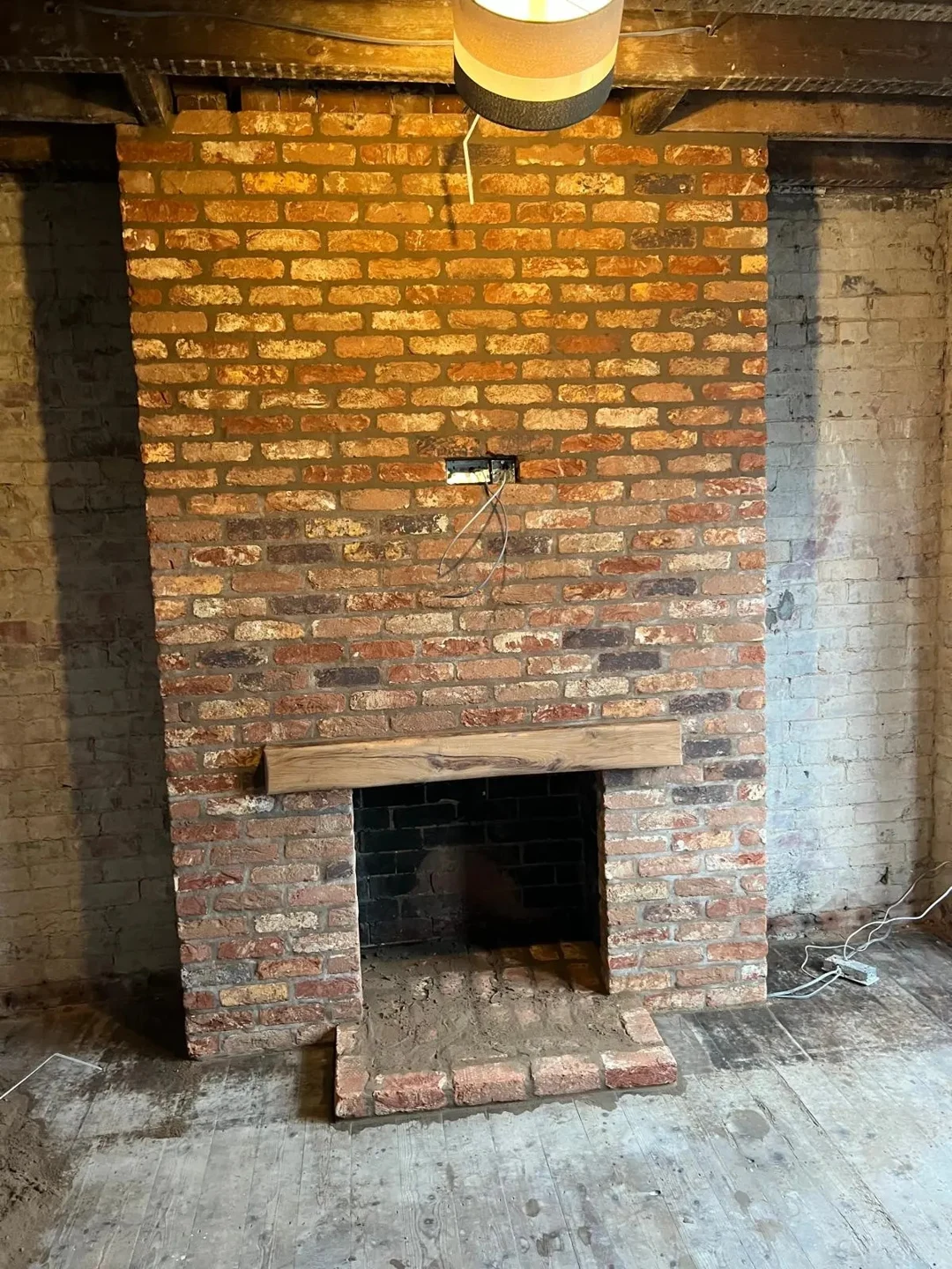 Brick fireplace — renovation in progress
